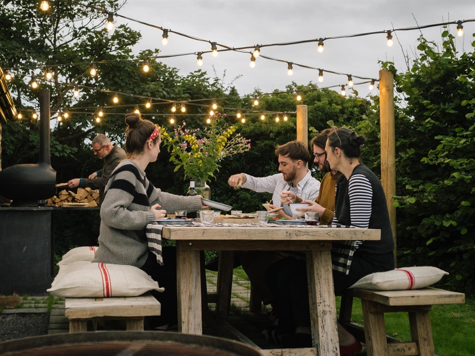 dine alfresco under the festoon lighting using the Mørsø wood fired pizza oven and large firepits uk bbq