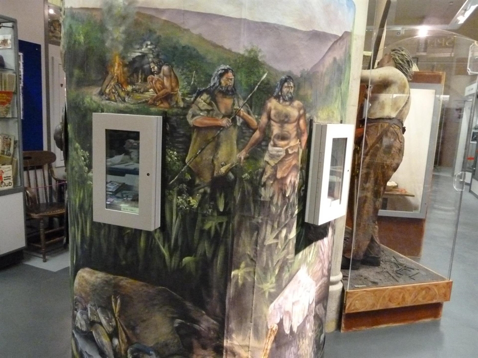 Stone Age axe and, a particularly fine example of, a Bronze Age Palstave (axe) which were found at Llanerch Padern, Cwmtillery. These are set in mural