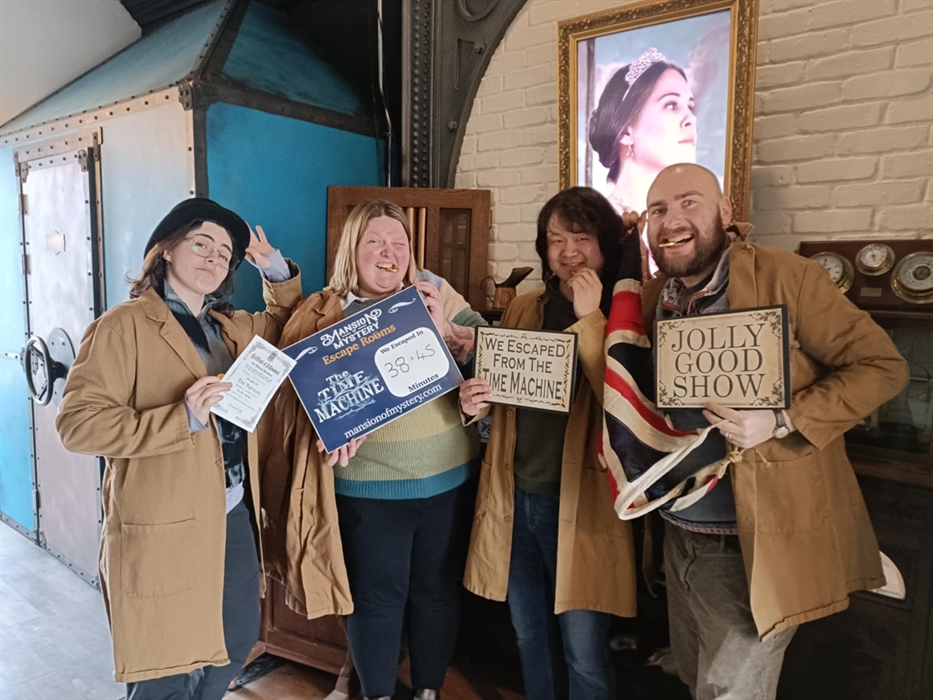 Group of friends solving puzzles together at Mansion of Mystery escape rooms in the St.Clears