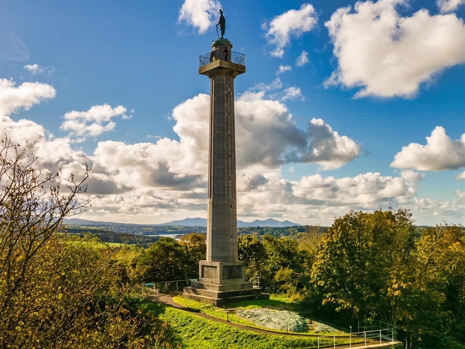 Historic Anglesey Column monument, commemorating the 1st Marquess of Anglesey, with stone architecture and scenic surroundings.