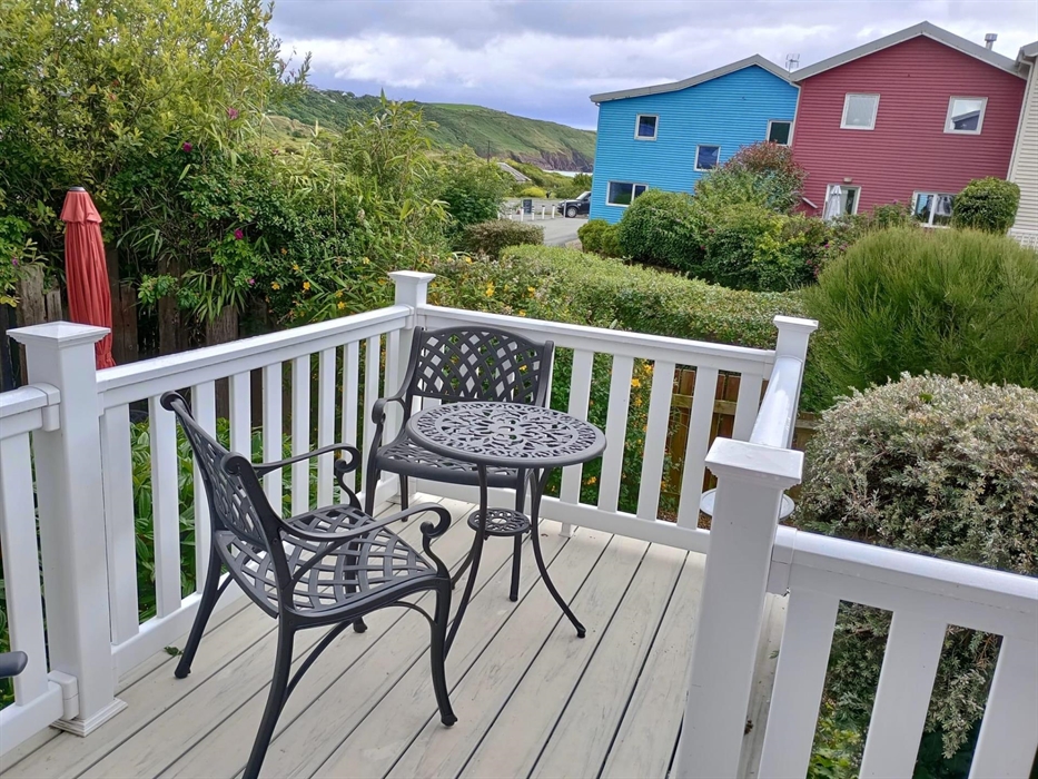There are three decks in total.  This is a view from the bottom deck. We love to eat breakfast here and hear the birdsong. We also have a little view