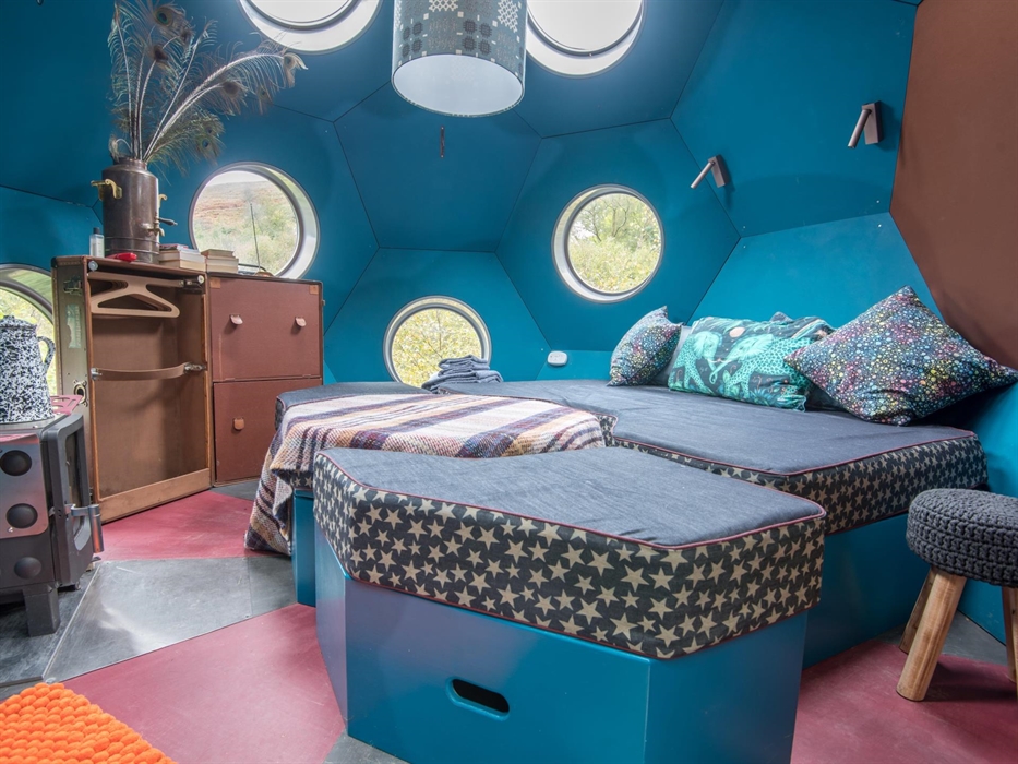 Interior - day, modular furniture doubles as a bed