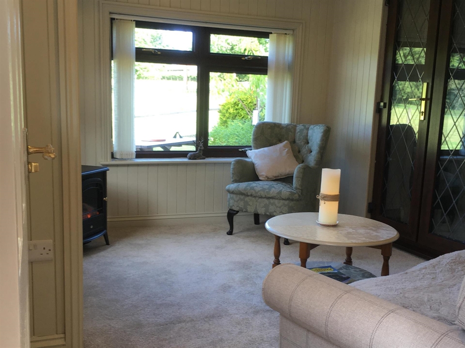 The Meadow Suite is a twin bedroom with bathroom en-suite and separate sitting area,  a private kitchen. and patio area with easy access to the garden