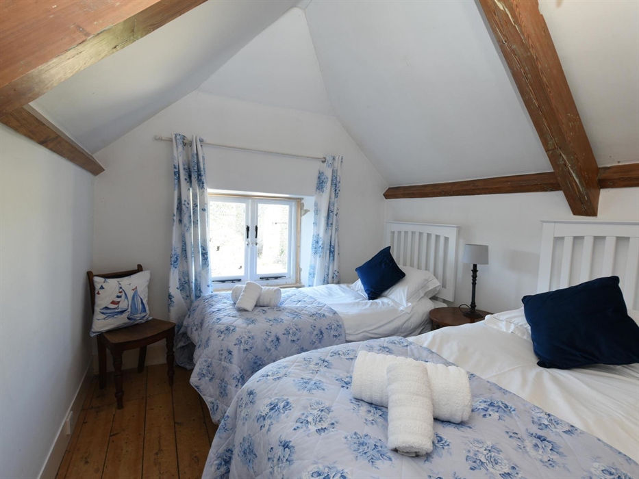 A cosy attic bedroom for 2 with views overlooking the courtyard
