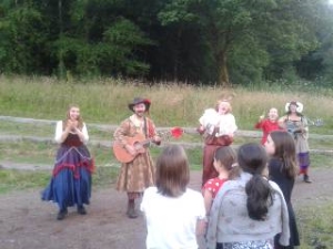 Actors performing at Parc Cwm Darran the play " As you Like it"