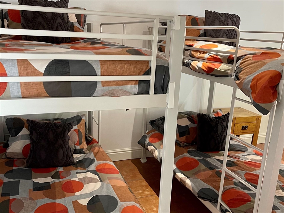 Each bunk has its own bedside table and dedicated reading lights.