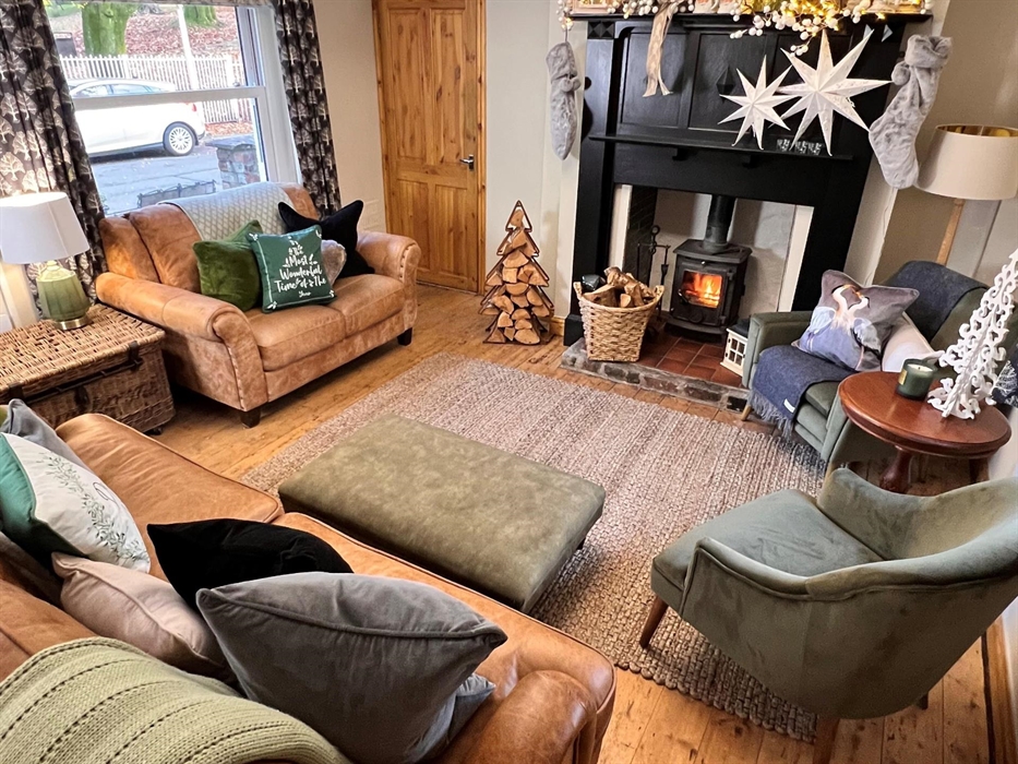 The second of two living rooms runs directly off the kitchen with pretty views to Thomastown Park just opposite.