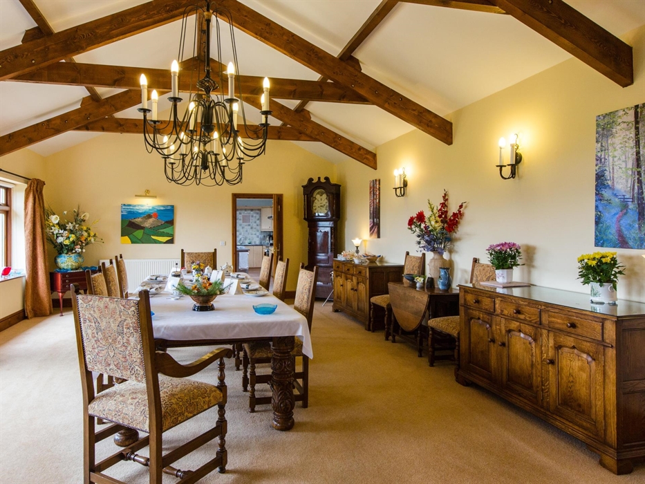 The Dining Room and the dining table set for breakfast.