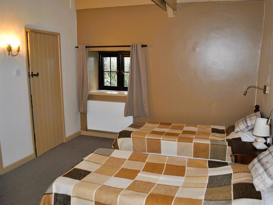 Newly carpeted and decorated, the twin bedroom boasts its own en-suite and is next to the lounge. It has windows to the front and back gardens.