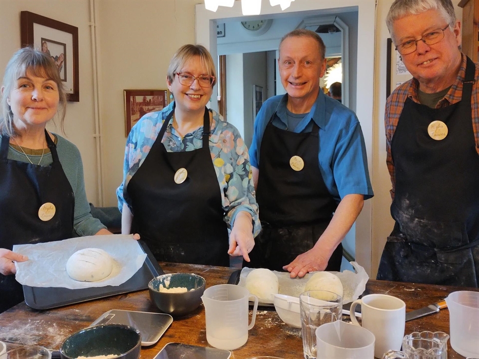 The class takes a break from learning how to make up the doughs which will go on to become wonderful, tasty breads.