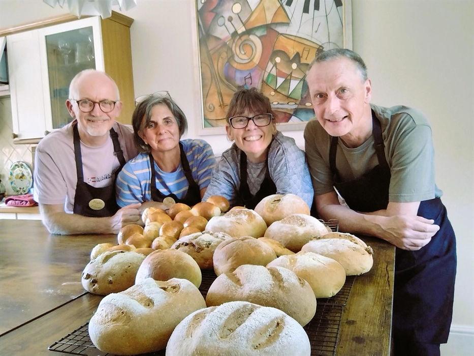Class participants look at some of the bread they have made