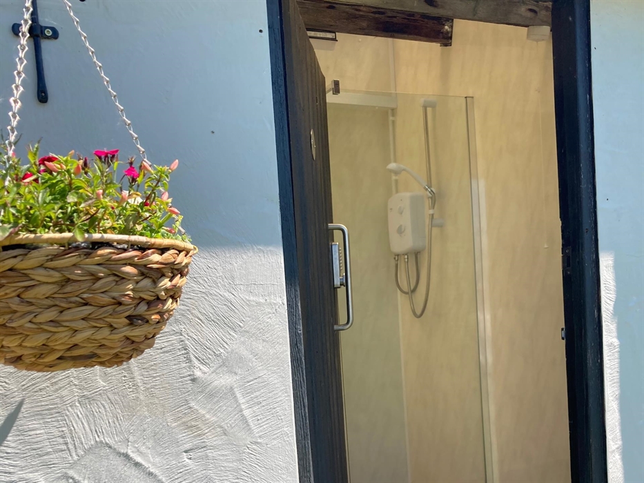 shower with hanging basket outside