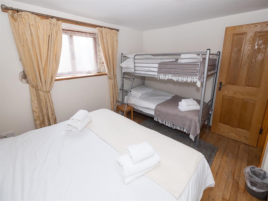 The Stables, bedroom 1 has a superking bed and bunk beds