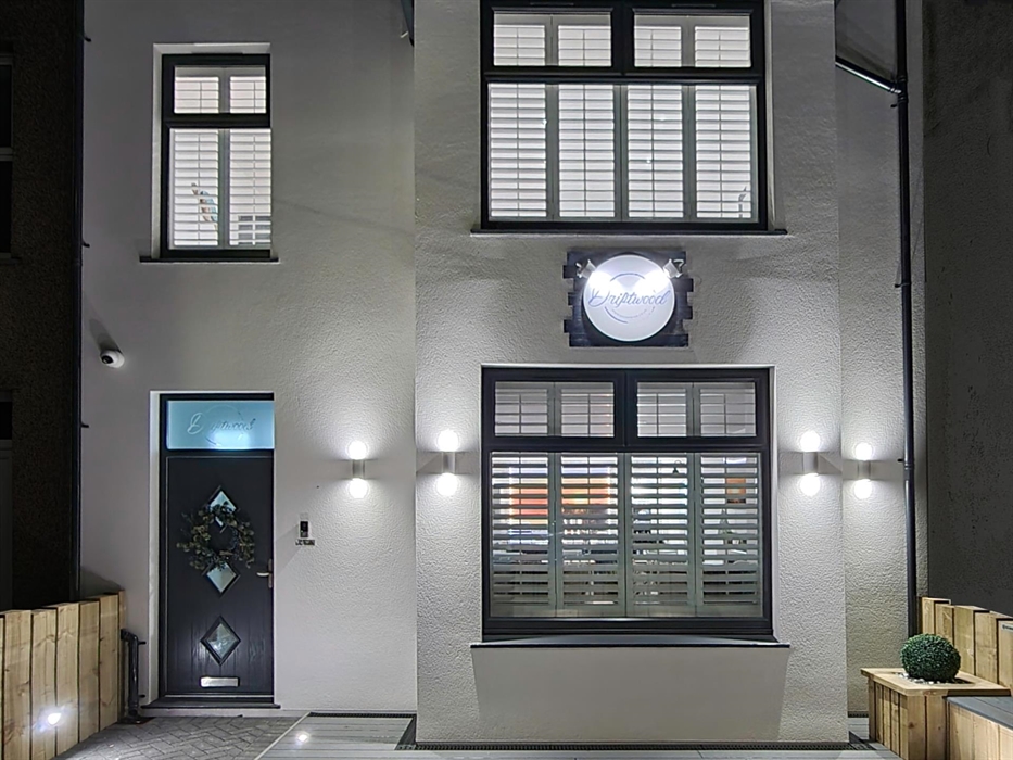 Driftwood lit up at night