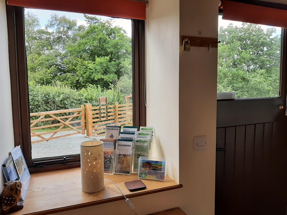 Ash Lodge and Sycamore Lodge entrance hall with coat hanging space and welcome leaflets.