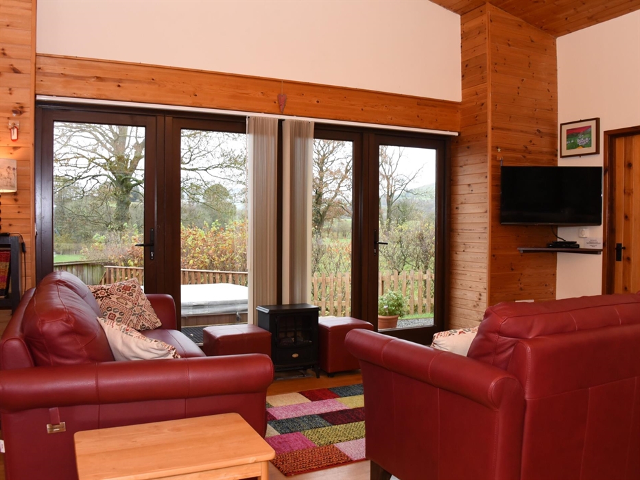 Lounge area with smart TV and a view across the countryside.