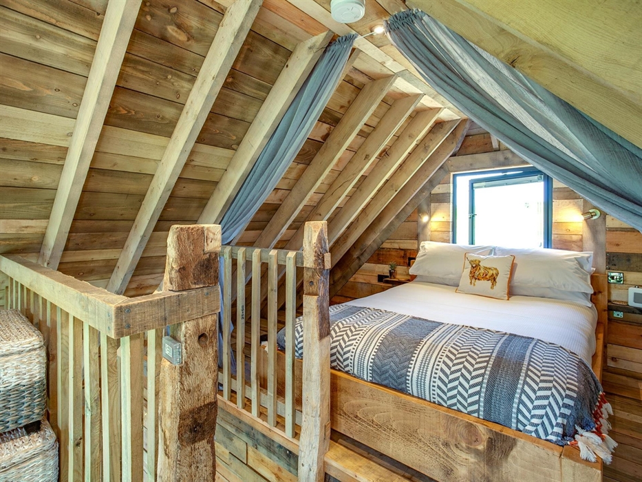 King size bed on the mezzanine floor at Cadwollen'