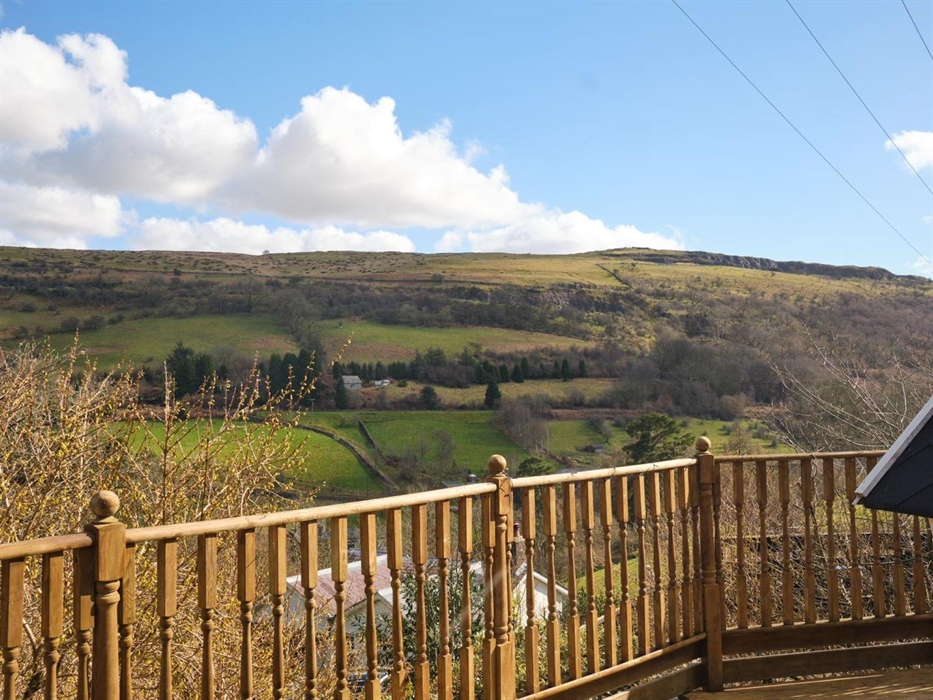 The view from Floras cabin is always a talking point, regardless of what the Welsh weather may throw at us! Private and secure Floras decking is perfe