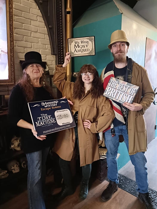 All generations enjoying a fun indoor activity at Mansion of Mystery, West Wales.