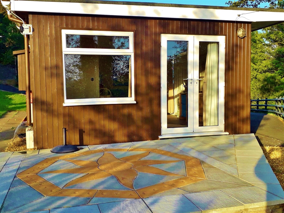 Elevated on a Wooded Hill, Sea Moss Cabin faces South West to the coast.