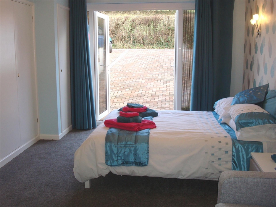 Ensuite bedroom from bathroom with parking