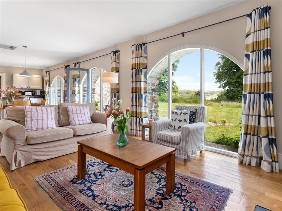 Sitting room with view over lawn &amp; estuary