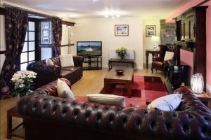 The Middleton open plan living area encompasses this spacious lounge area with double doors leading to a large conservatory porch and the double doors