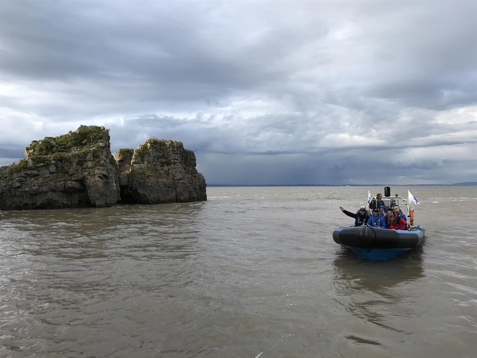 Rib boats approaching Flat Holm Island.
