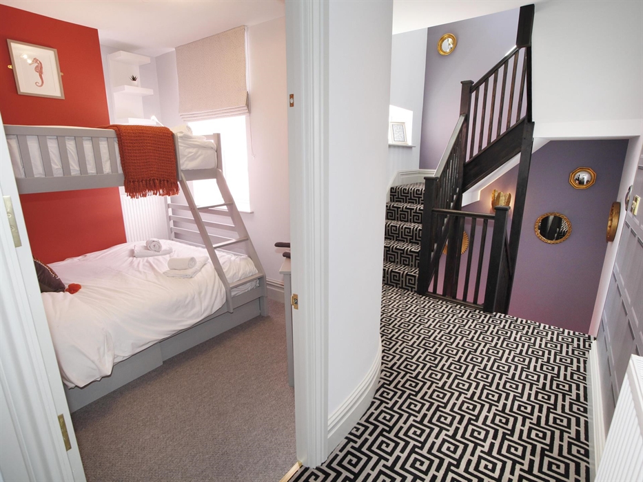single over and double under bunkbed. TV. situated on the first floor.