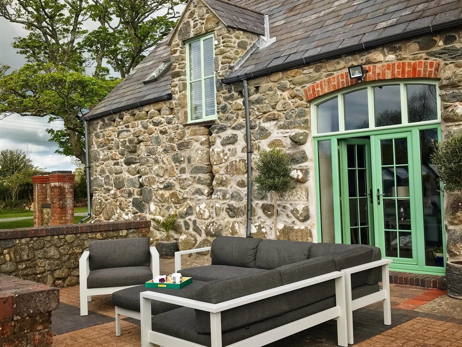 Photo of the outside lounge at Ysgubor Degwm holiday let in North Wales