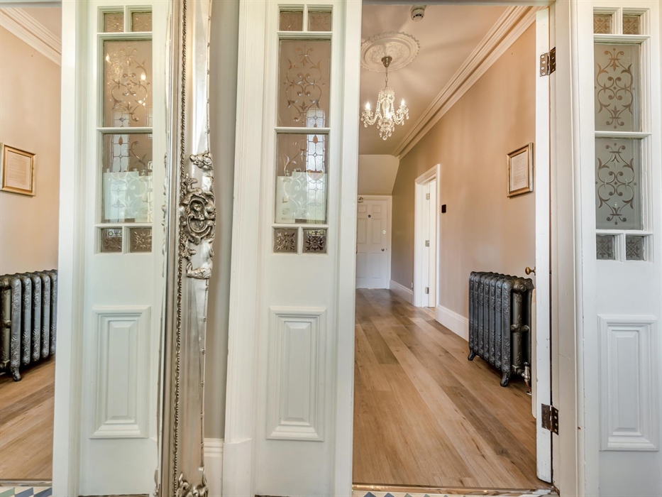 Hallway to stairs and kitchen