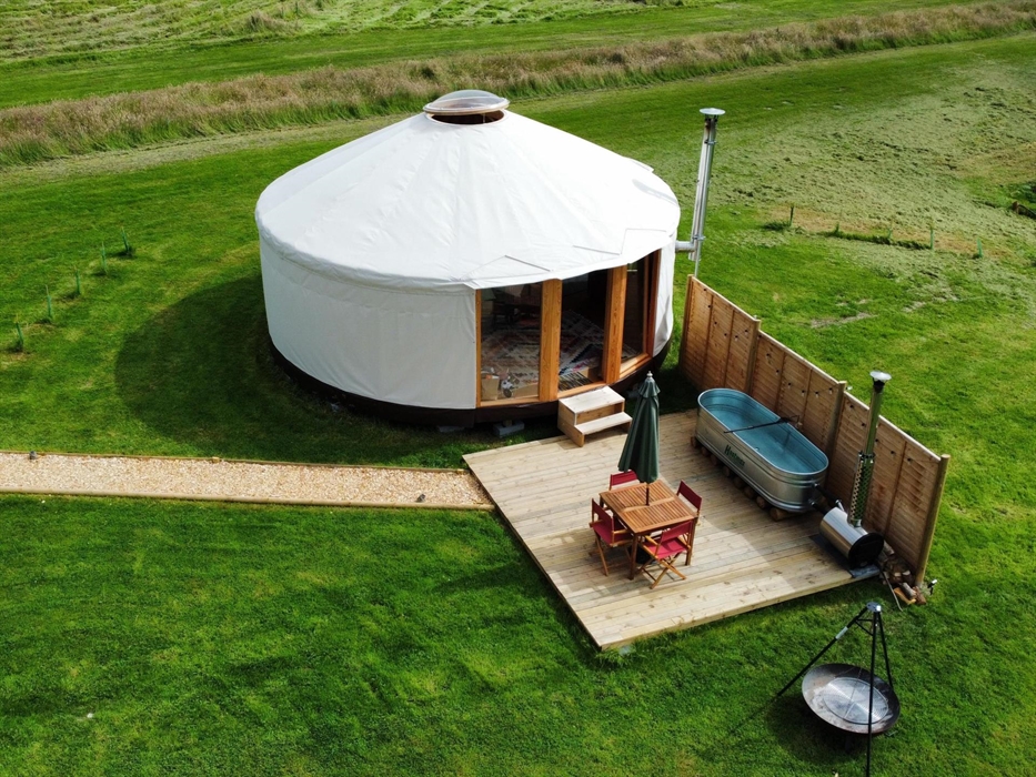 Stunning luxury yurt with the unique wood fired hippie hot tub, deck and firepit. With your own private shower, kitchen and flushing toilet.