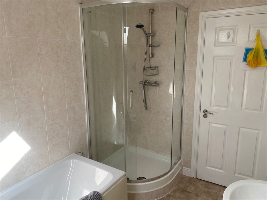First floor bathroom with shower, bath, wash hand basin  and WC