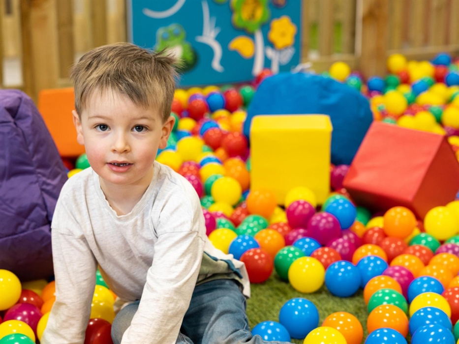 Ball pit with boy