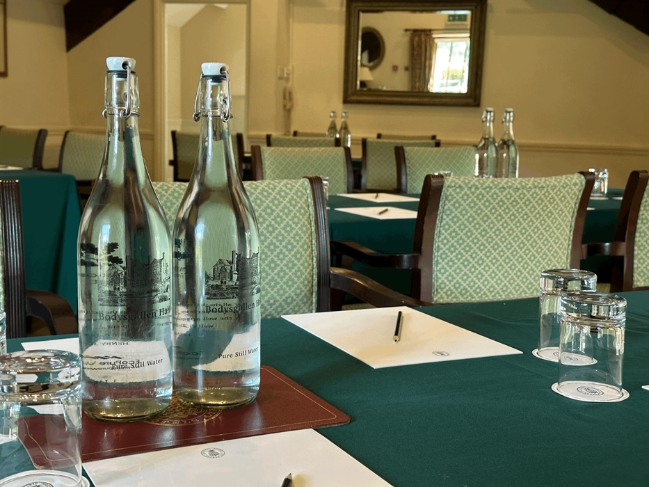 Set up includes, mineral water, pads, pencils, sweats