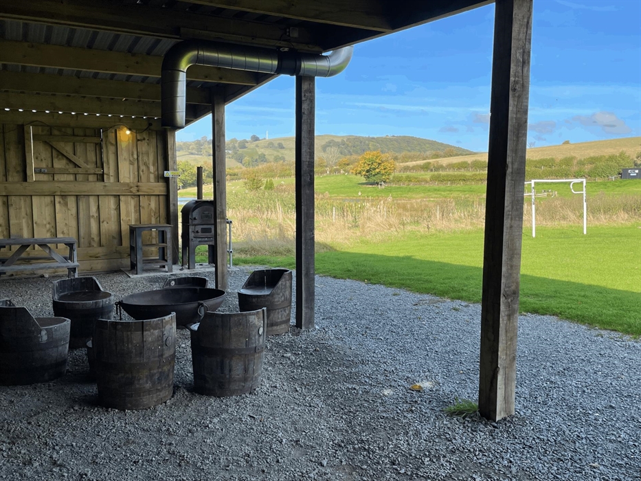 Our all weather shelter is perfect for get togethers what ever the weather. With a large fire pit BBQ and pizza oven its perfect for family get togeth