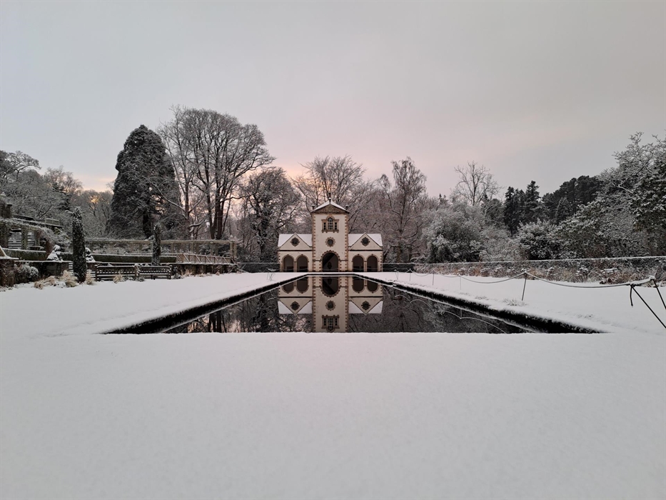 Snow covers the surrounding lawn and roof of the Pin Mill on the Canal Terrace at Bodnant Garden, Conwy, in North Wales