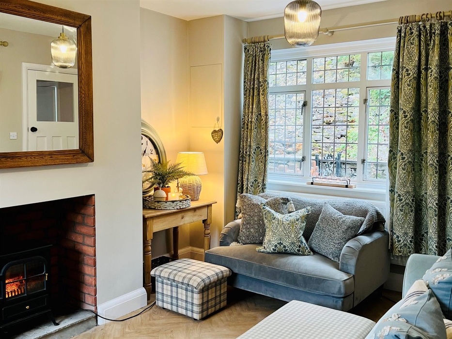 Our cosy, quiet, dual aspect living room. Perfect for an evening with the family playing games or chilling watching TV. NOTE: The living room fire is