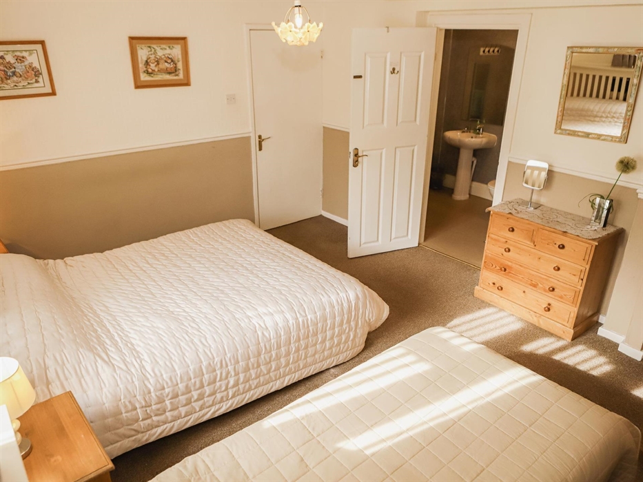 Family bedroom with full bathroom suitable for dis