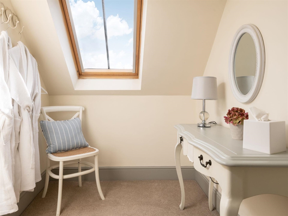 A dressing table in the upstairs bedroom