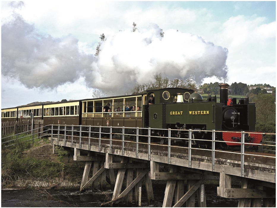 The train crosses the river Rheidol as it leaves Aberystwyth.