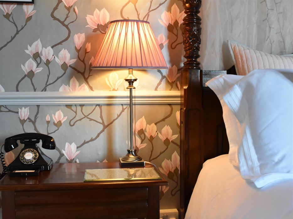 Our most spacious double room, decorated in creams and golds and featuring a 7ft four-poster bed. Step down into the ensuite bathroom which is fitted