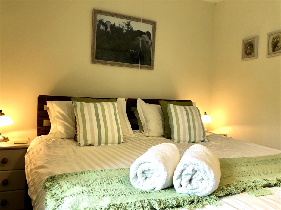 Superking zip and link bed can become 2 adult singles together with temporary bed in opposite corner for 1 extra