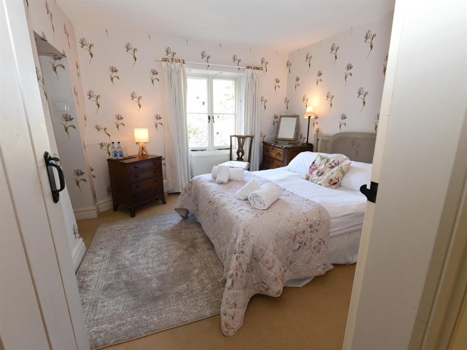 A beautifully styled double bedroom with ensuite facilities