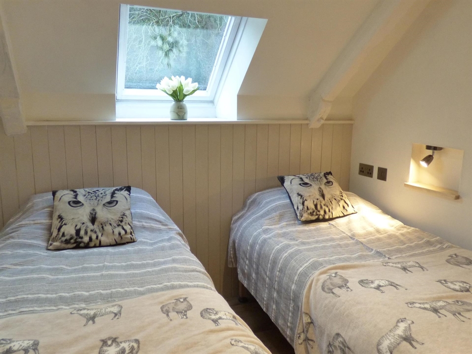 The twin bedroom at Yr Hal with Velux window to the front.
