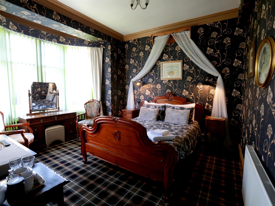 Indulge in the morning glow with a beautiful bay window in this room, offering ample light for your daily routine. 
Unwind and savor the inviting amb