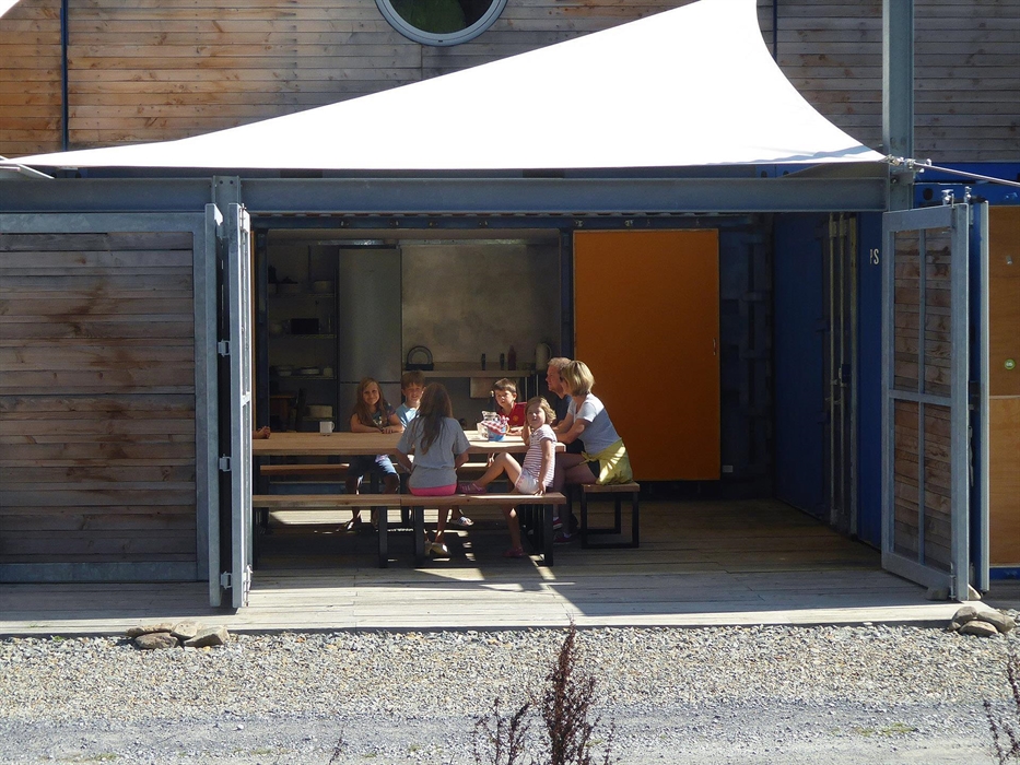 With all the doors open looking through the boatdeck into the Kitchen and indoor dining area.