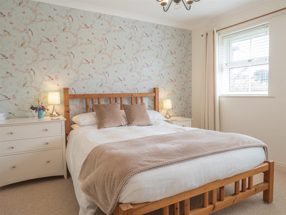 The King bedroom in Tydu View Cottage