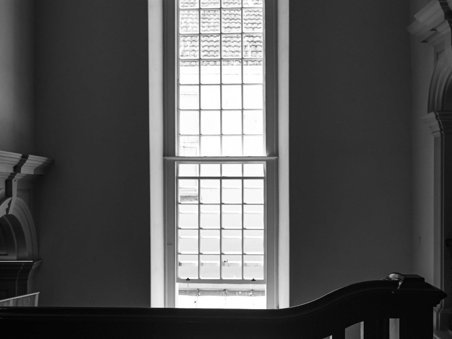 A stunningly tall window lights up the grand staircase, painstakingly reconstructed into its new found Georgian glory.