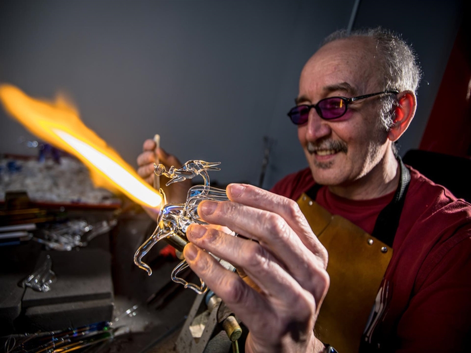 Delyn Glass at Corris Craft Centre work with glass and create stunning sculptures of wildlife, flowers and fantasy dragons. Kevin can be seen with a h